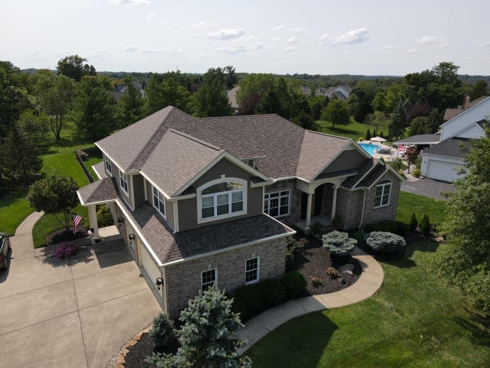 A drone view of a home with brand new siding installed by Coldstream Exteriors